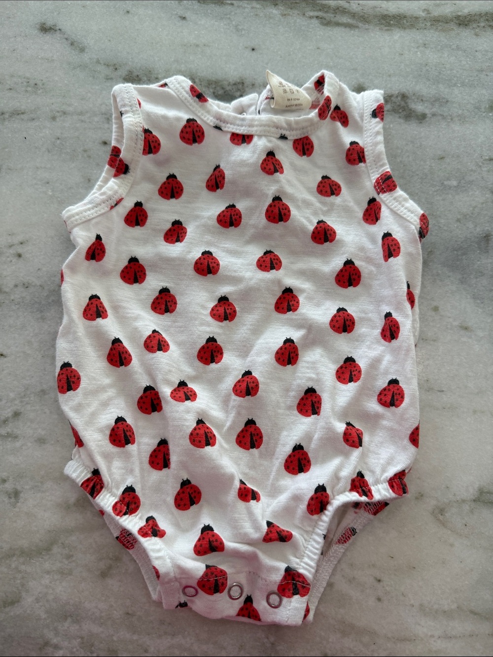 Kids White One-Piece Bodysuit with Red Ladybug Print